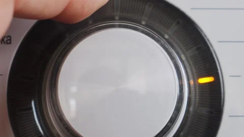 The washing machine's washing mode selection switch is turned on. Medium shot Video stock 315065384