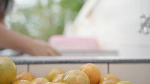 Washing oranges before eating Stock Footage 117291321