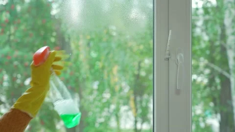 Washing a plastic window in the summer. Stock Footage 164677092