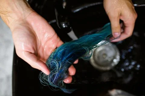 Washing procedure. Client is resting while her hair is being cleansed Stock Photos