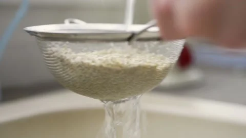 Washing quinoa Stock Footage 140268652