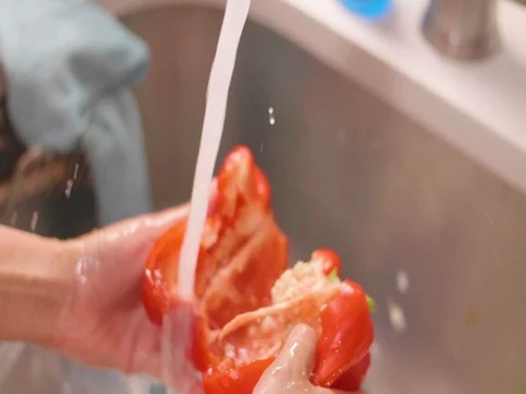 Washing red pepper in slow motion Stock Footage 80562198
