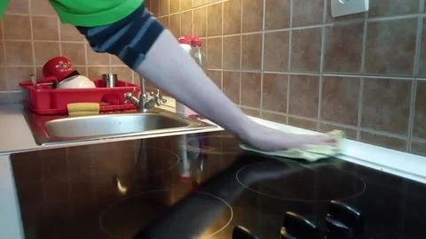 Washing the surface of the plate Stock Footage 221623460