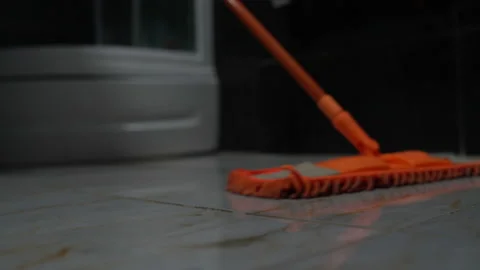 Washing tiles with a mop in the bathroom Stock Footage 101668629