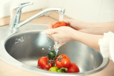 Washing vegetables Stock Photos
