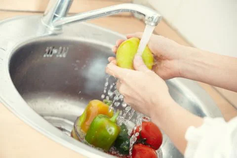 Washing vegetables Stock Photos