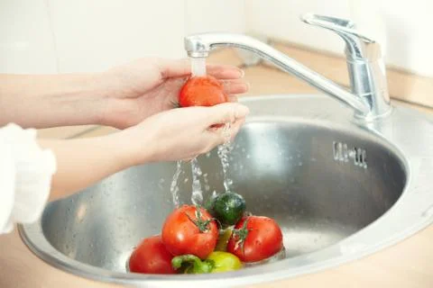 Washing vegetables Stock Photos
