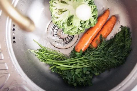 Washing vegetables Stock Photos