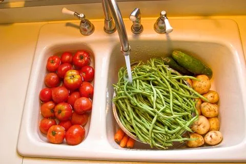 Washing vegetables Stock Photos