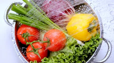 Washing Vegetables in the sink Stock Footage 10563000
