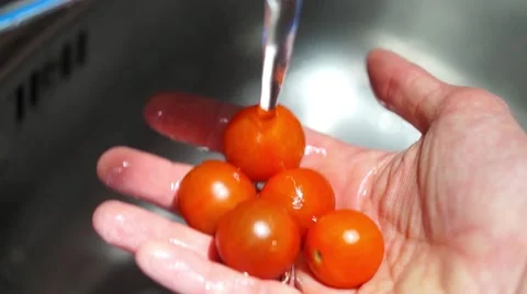 Washing vegetables under the tap Stock Footage 60820156
