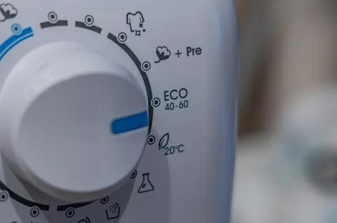 Washing in a washing machine, ecological program, saving energy and water Stock Photos