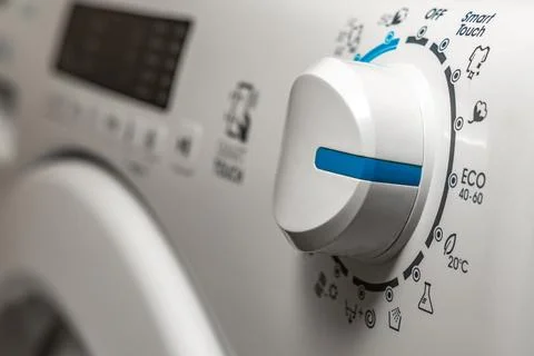 Washing in a washing machine, ecological program, saving energy and water Stock Photos