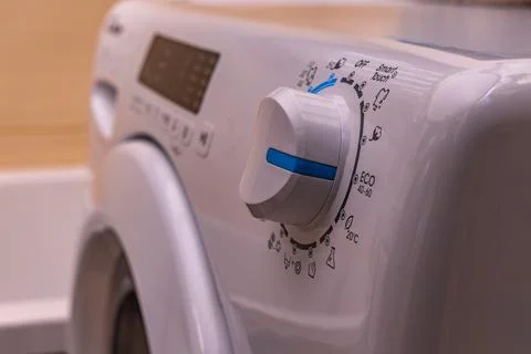 Washing in a washing machine, ecological program, saving energy and water Stock Photos