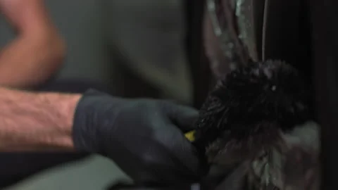 Washing of wheels and rubber. Drawing of detergent on disks of the car. close up Stock Footage 141023477