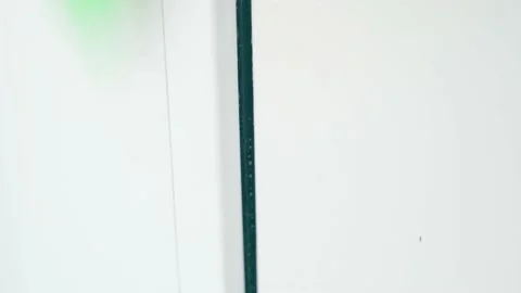 Washing a white plastic surface close-up with a sponge and detergent Stock Footage 202644750