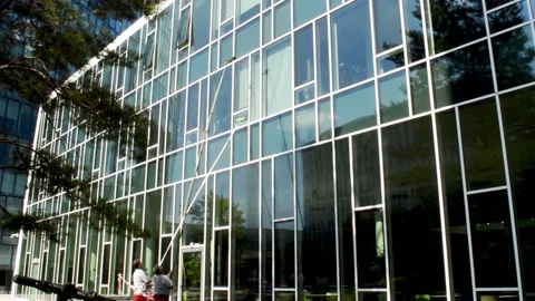 Washing windows on the upper floors Stock Footage 137751615