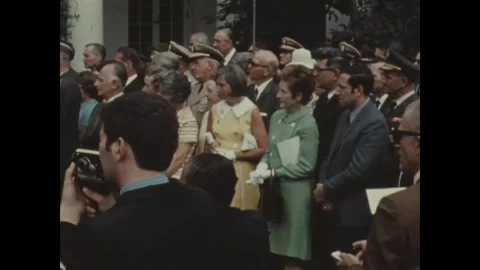 WASHINGTON - 1970: Programs — Guests in patterned dresses Stock Footage 347314226
