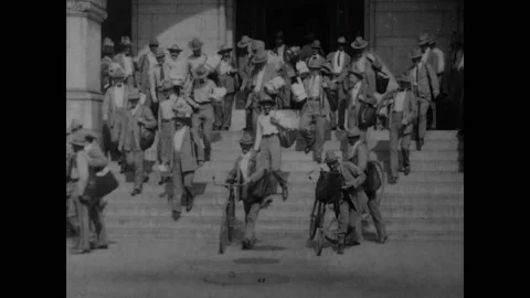 WASHINGTON DC - 1903 - Uniformed U.S. mail carriers exit the main post office, Stock Footage 308173203