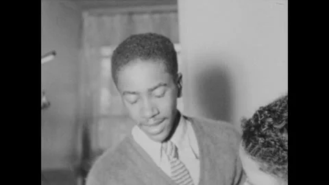 Washington DC 1930s: Boy plays violin in orchestra. Man in uniform plays violin Stock Footage 329699638
