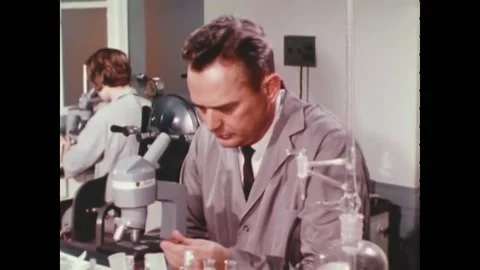 WASHINGTON DC - 1960s - Lab technicians at FBI headquarters use myriad kinds of Stock Footage 254201272