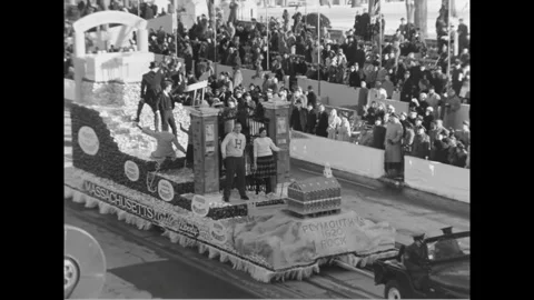 WASHINGTON DC - 1961 - A Jeep pulls a float with Harvard students representing Stock Footage 341990647