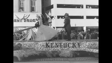 WASHINGTON DC - 1961 - A man waves from a March of Dimes float with a fairy tale Stock Footage 341990613