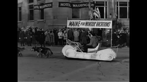 WASHINGTON DC - 1961 - Sled dogs pull a sled representing Maine and women waving Stock Footage 341990643