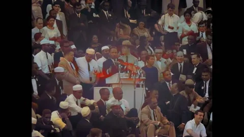 WASHINGTON DC - 1963 - Crowds clap and sing with Martin Luther King's "I Have a 스톡 동영상 259380383