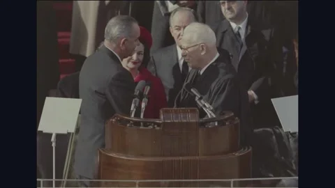 WASHINGTON DC - 1965: Johnson Inauguration — Johnson takes oath Stock Footage 342589494