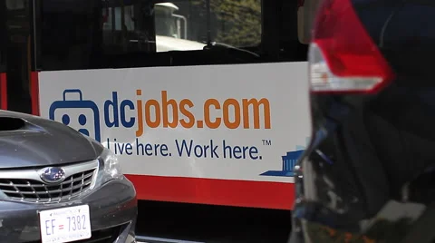 Washington D.C. Bus Pulling Away on Street Stock Footage 46746484