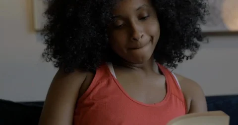 Washington, DC Circa June 2019: Woman Reads Book at Home Stock Footage 111160902