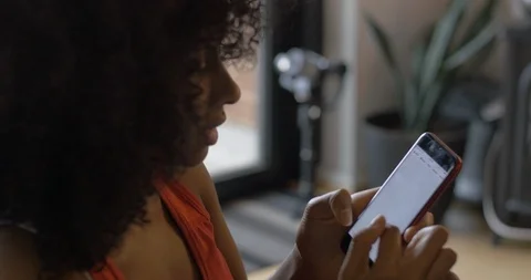 Washington, DC Circa June 2019: Black Woman Looks at Social Media in Home Stock Footage 111161002