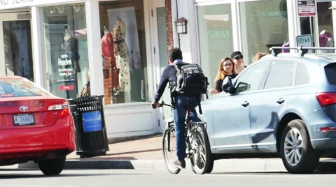 WASHINGTON, DC - MAR. 2016 . Man Riding Bike in Georgetown DC in Slow Motion 스톡 동영상 61445920