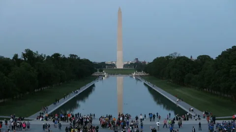 Washington Monmuent &amp; Reflection Pool Evening with Tourists Slow Motion Stock Footage 64107119
