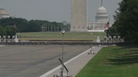 The Washington Monument and the US Capitol beyond the Reflecting Pool Stock Footage 345283406
