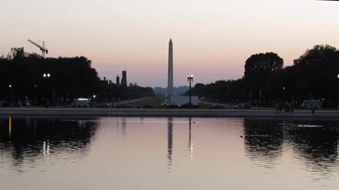 Washington Monument, Capitol Reflecting Pool, ducks DC sunset wide 8/24/21 Stock Footage 159772102