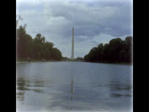 Washington Monument reflecting in Reflecting Pool. 8mm film footage. Stock Footage 75229507