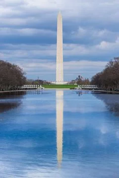 Washington Monument reflection pool cloudy blue sky day Washington DC USA Stock Photos