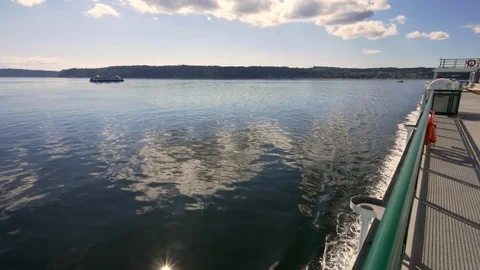Washington State Ferry passes another from Clinton, Whidbey Island to Mukilteo. Stock Footage 98010854