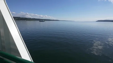 Washington State Ferry passes another from Clinton, Whidbey Island to Mukilteor. Stock Footage 98010911