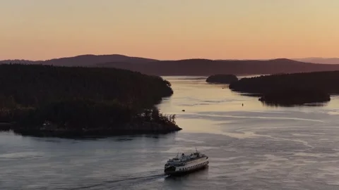 Washington State Ferry Passing Shaw Island at Sunset San Juan Islands Stock Footage 335714322