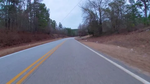 Waste and trash discarded on the side of a rural road in the south 4 Stock Footage 147002926