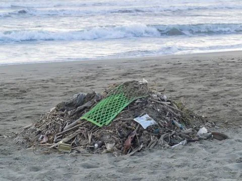 Waste on the beach: lots of  plastic causing sea pollution Stock Photos