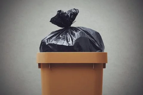 Waste bin with garbage bag Stock Photos