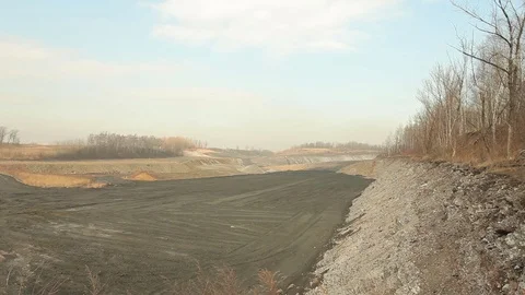 Waste from black coal mining dumps, ash wasteland slow burn, pollution Stock Footage 70667909