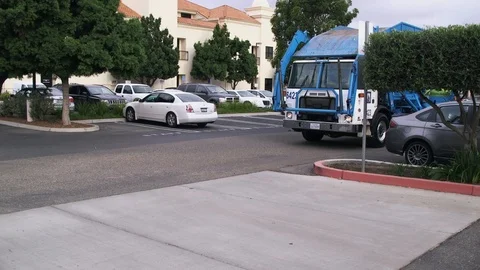 Waste Collections Driver Gets Out, Positions Bin, and Dumps It 库存影片 97651278
