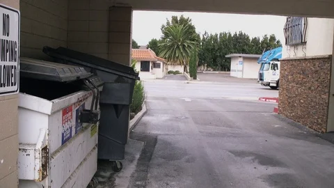 Waste Collections Driver Getting Out of Truck and Positioning Bin 库存影片 97646863