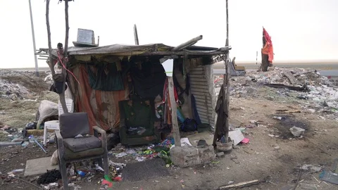 Waste dump with a hut of waste in the third world Stock Footage 120831604