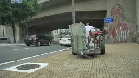 Waste picker pulling a trolley Stock Footage 168537101